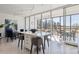 Eat-in kitchen featuring modern appliances, a central island, and access to an outdoor patio at 1201 N Williams St # 3A, Denver, CO 80218