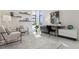 Bright seating area and desk space with modern decor and neutral colored furniture at 1201 N Williams St # 3A, Denver, CO 80218