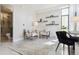 Bright seating area adjacent to the bathroom featuring a work space and modern furniture at 1201 N Williams St # 3A, Denver, CO 80218