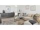 Cozy living room with a plush sectional sofa, stylish decor, and contemporary artwork at 1201 N Williams St # 3A, Denver, CO 80218