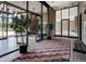 Welcoming lobby area with plants, a large rug, lots of glass and an outdoor view at 1201 N Williams St # 3A, Denver, CO 80218