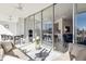Bright enclosed patio featuring a sitting area, dining table and sliding glass doors leading inside the home at 1201 N Williams St # 3A, Denver, CO 80218