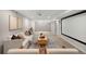 A finished basement featuring a large movie screen, plush seating, and stylish decor at 1035 S Garfield St, Denver, CO 80209