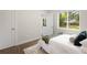 Bright bedroom with hardwood floors and windows offering natural light at 1035 S Garfield St, Denver, CO 80209