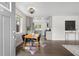 Open floor plan with a view into the kitchen, featuring stainless steel appliances and modern cabinetry at 1035 S Garfield St, Denver, CO 80209
