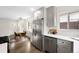 Well-lit kitchen features stainless steel appliances, white countertops, and a breakfast nook at 1035 S Garfield St, Denver, CO 80209