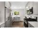 Updated kitchen with stainless steel appliances, gray cabinetry, and bright countertops at 1035 S Garfield St, Denver, CO 80209