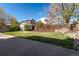 Fenced backyard with mature trees and a shed at 12743 Eudora Dr, Thornton, CO 80241