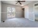 This is a bedroom featuring a sliding door to a balcony, ceiling fan, and carpet at 12743 Eudora Dr, Thornton, CO 80241