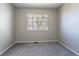 Empty bedroom features wall to wall carpeting, neutral paint and one window at 12743 Eudora Dr, Thornton, CO 80241