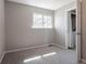 This bedroom features neutral paint, carpet, and a window view at 12743 Eudora Dr, Thornton, CO 80241