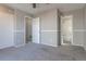 Empty bedroom boasts neutral tones, closet, and adjoining door to the on-suite bathroom at 12743 Eudora Dr, Thornton, CO 80241