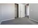 Empty bedroom features wall to wall carpeting, an open closet, and access to the bathroom at 12743 Eudora Dr, Thornton, CO 80241