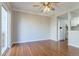 Open-concept room features laminated wood flooring and sliding doors to the outside at 12743 Eudora Dr, Thornton, CO 80241