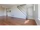 Open living room features stairs to the second floor and an open entry and kitchen at 12743 Eudora Dr, Thornton, CO 80241