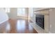 Living room showcasing hardwood floors, a fireplace, and staircase, highlighting open and inviting space at 12743 Eudora Dr, Thornton, CO 80241