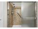Modern bathroom shower featuring stylish tile, rainfall shower head, and safety bar at 2360 Santa Fe Dr # B, Longmont, CO 80504