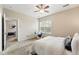 Comfortable bedroom with a ceiling fan and a large window for natural light at 2360 Santa Fe Dr # B, Longmont, CO 80504