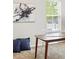 Bright bedroom featuring two windows, artwork, and blue pillows at 2360 Santa Fe Dr # B, Longmont, CO 80504