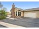 Charming home with a two-car garage, stone chimney, and well-manicured lawn at 2360 Santa Fe Dr # B, Longmont, CO 80504