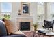 Close-up of the living room fireplace with stylish mantel decor and comfortable seating at 2360 Santa Fe Dr # B, Longmont, CO 80504