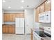 This kitchen is equipped with stainless appliances, plenty of cabinet space, and a tile floor at 2360 Santa Fe Dr # B, Longmont, CO 80504