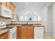 Well-lit kitchen features stainless steel appliances, granite counters, and easy access to the living space at 2360 Santa Fe Dr # B, Longmont, CO 80504
