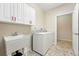 Functional laundry room with a sink, washer, and dryer at 2360 Santa Fe Dr # B, Longmont, CO 80504