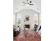 Bright living room features vaulted ceilings, abundant natural light, a fireplace and modern decor at 2360 Santa Fe Dr # B, Longmont, CO 80504
