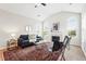 Bright living room featuring vaulted ceilings, fireplace, and large arched windows at 2360 Santa Fe Dr # B, Longmont, CO 80504