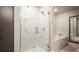 Bathroom showcasing a glass-enclosed shower, a soaking tub, and modern fixtures at 20 Wilcox St # 302, Castle Rock, CO 80104