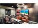 Stylish entertainment room with comfortable seating, TV, and tables at 20 Wilcox St # 302, Castle Rock, CO 80104
