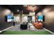 Entertainment room featuring multiple TVs, lounge seating, and game tables at 20 Wilcox St # 302, Castle Rock, CO 80104