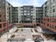 Wonderful exterior shot of Encore, a modern apartment complex with an inviting courtyard and upscale shops at 20 Wilcox St # 302, Castle Rock, CO 80104