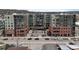 Modern apartment building with a mix of brick and gray siding, and well-maintained landscaping at 20 Wilcox St # 302, Castle Rock, CO 80104