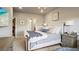 Bedroom featuring a comfortable tufted headboard, soft pillows, side tables, modern decor, and a view at 20 Wilcox St # 302, Castle Rock, CO 80104
