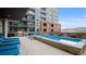 Rooftop pool and lounge area with comfortable seating and BBQ grill at 20 Wilcox St # 302, Castle Rock, CO 80104