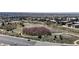 Aerial view of a serene park with walking trails and open green space in a suburban area at 2353 S Jamaica St, Aurora, CO 80014