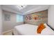 Inviting room showcases a stylish headboard, accent wall, and soft bedding at 2353 S Jamaica St, Aurora, CO 80014