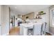 Bright kitchen with a central island, stainless steel appliances, and open access to the dining area at 2353 S Jamaica St, Aurora, CO 80014