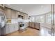 Modern kitchen with stainless steel appliances, white subway tile backsplash, and a bright, airy atmosphere at 2353 S Jamaica St, Aurora, CO 80014
