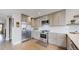 Well-appointed kitchen featuring stainless steel appliances, ample cabinet space, and a functional layout at 2353 S Jamaica St, Aurora, CO 80014