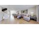 Spacious living room with hardwood floors, a large sectional sofa, and stylish decor at 2353 S Jamaica St, Aurora, CO 80014