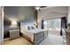 Spacious main bedroom boasts a high ceiling, accent wall, and large window offering an abundance of light at 2353 S Jamaica St, Aurora, CO 80014