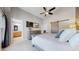 Bright main bedroom features a walk-in closet, ensuite bath and a large picture window at 2353 S Jamaica St, Aurora, CO 80014