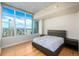 Bright bedroom with hardwood floors and stunning city views at 891 14Th St # 3807, Denver, CO 80202