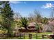 Scenic aerial view of the property, showing the fenced backyard, storage shed, and outdoor living area at 6963 E Heritage S Pl, Centennial, CO 80111