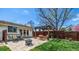 Inviting backyard patio area with pergola, fire pit, and comfortable seating, perfect for outdoor entertaining at 6963 E Heritage S Pl, Centennial, CO 80111