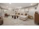 Basement living room with neutral walls, recessed lighting, and a white sofa with throw pillows at 6963 E Heritage S Pl, Centennial, CO 80111