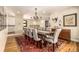 Open dining room with a large table and access to staircase at 6963 E Heritage S Pl, Centennial, CO 80111